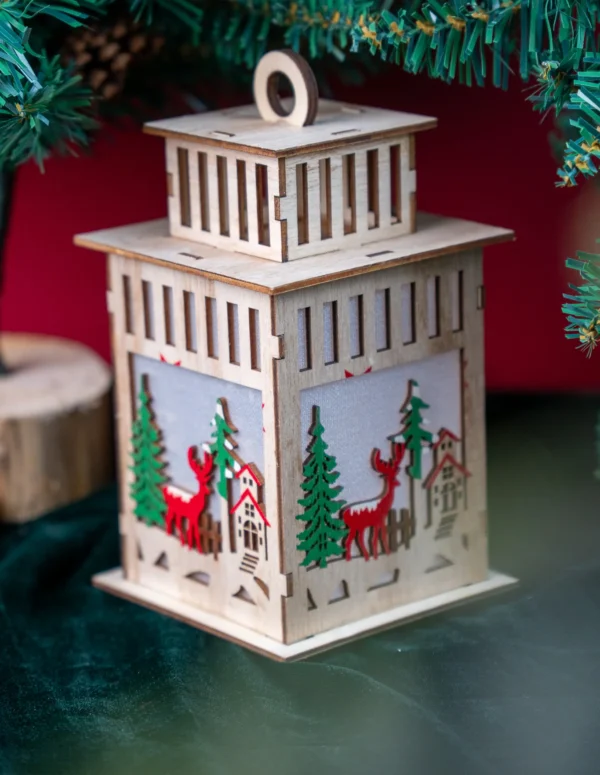 Wooden Christmas Lantern with Reindeer Scene - Laser-Cut Festive Tabletop Lantern - Nordic Style Winter Village Decor with Red Reindeer and Pine Tree Details